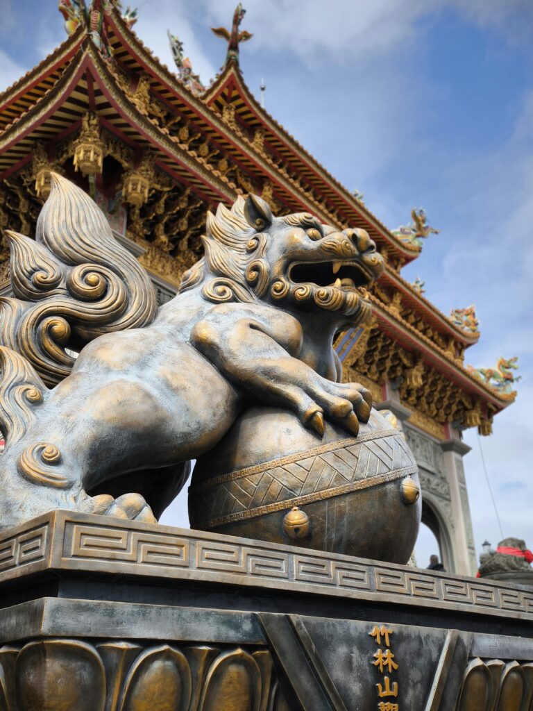 Close-up of a traditional Chinese temple guardian lion statue in Taiwan.
