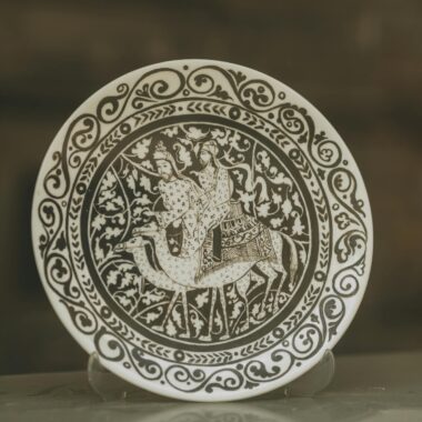 Decorative plate with elaborate patterns and figures, a perfect art piece.