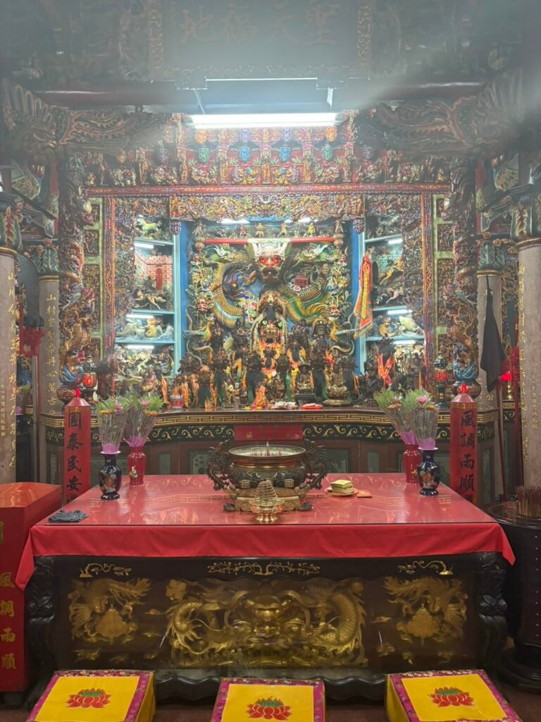 Main altar and deity display inside Xishan Temple