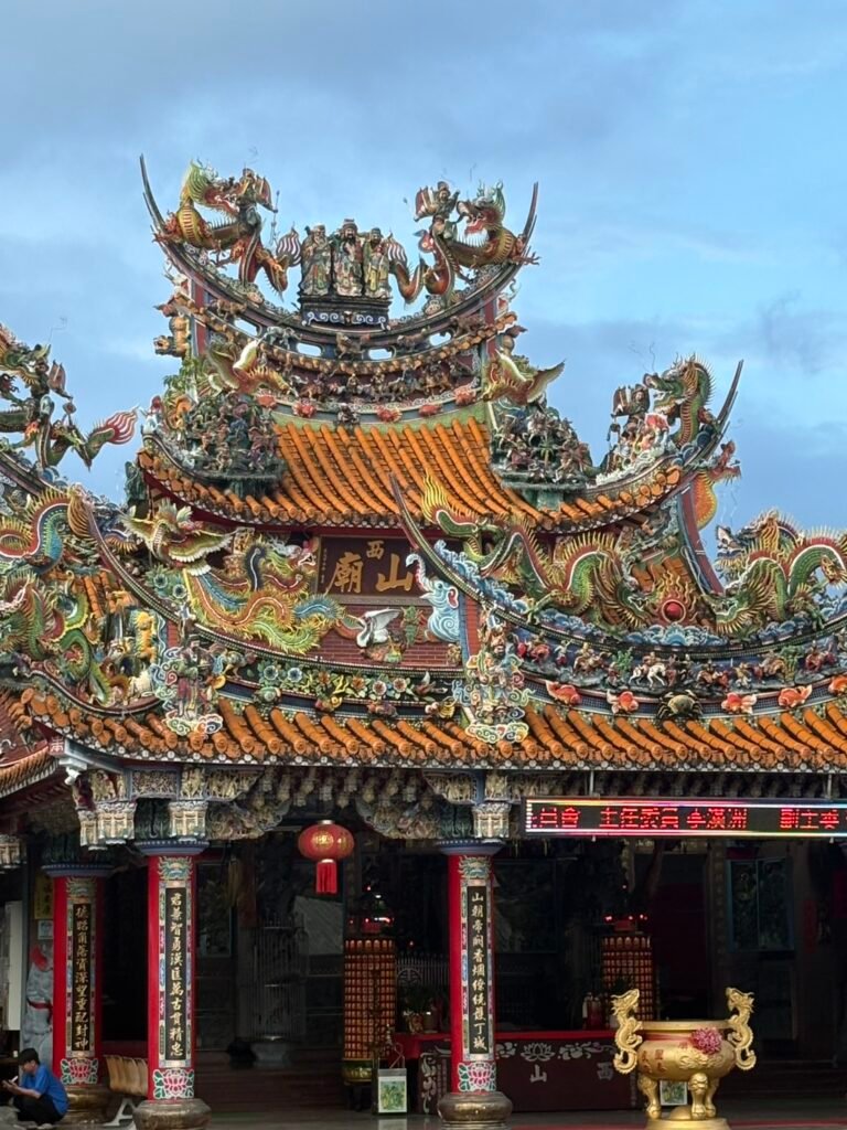 Ornately decorated roof and entrance of Xishan Temple